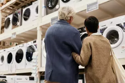 Back view of senior couple in household appliances store